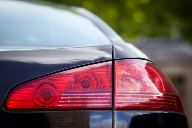Red tail light of a black car