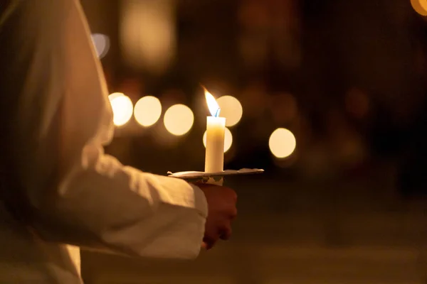 Image of People handling candles in the hands. Christmas and lucia holidays