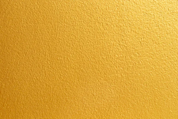 以旧墙混凝土纹理为背景的金黄色 — 图库照片