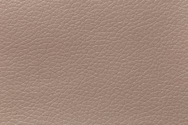 Grayish orange leather and a textured background.