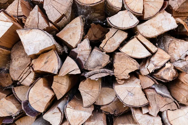 stock image Closed up pile of firewood background.