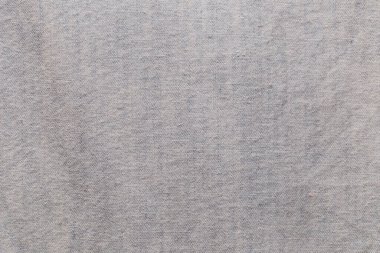 Kumaş arka plan ve mavi renk uzun kollu kot pantolon deseninin yakın çekimi.