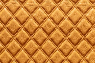 Orta turuncu deri ve desenli bir arka plan..