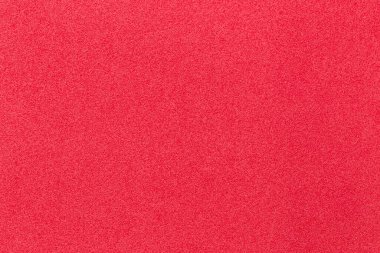 Kırmızı bir strafor doku arkaplanının yakın plan görüntüsü.