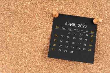 Tahta raptiyeli Nisan 2025 için siyah takvim sayfası, kopyalama alanı olan konum.