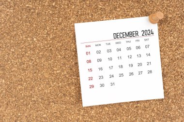 Aralık 2024 için tahta raptiyeli beyaz takvim sayfası.