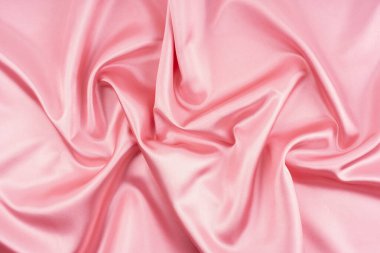 Lüks gerçekçi pembe ipek, arka plan olarak saten tekstil..