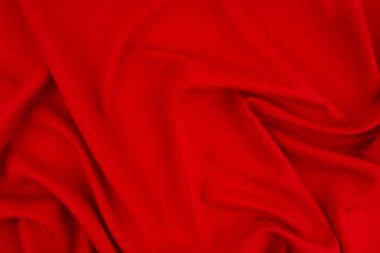 Arkaplan olarak buruşmuş kırmızı saten dokusu.