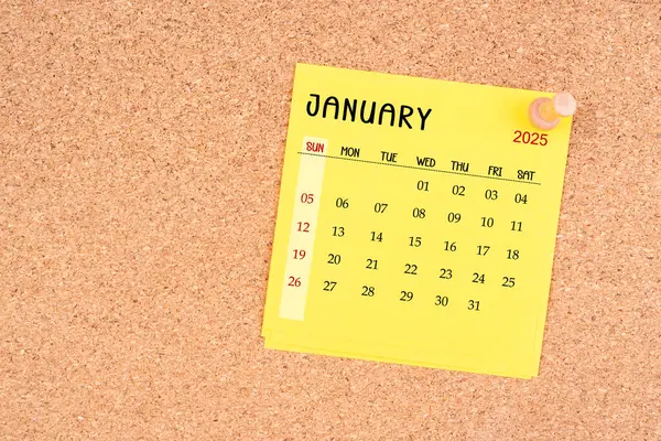 Yellow Calendar Sheet January 2025 Thumbtack Wooden Board — Stock Photo, Image