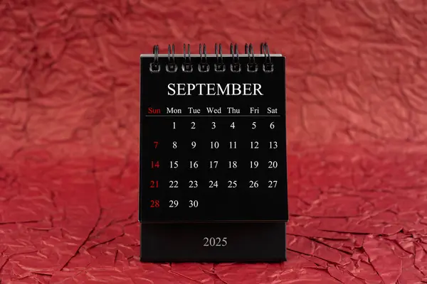 September 2025 Front View Black Desk Calendar Crumpled Red Paper — Stock Photo, Image