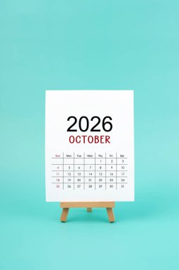 Takvim sayfası Ekim 2026 Yeşil zemin üzerinde beyaz renk.