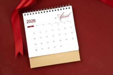 Nisan 2026 masa takvimi ve kırmızı arkaplanda kırmızı kurdele.