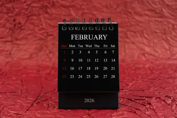 February 2026 Front View Black Desk Calendar Crumpled Red Paper — Stock Photo, Image