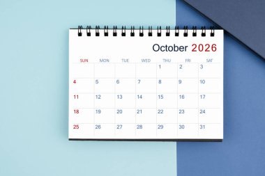 2025 yılı için mavi arkaplanlı aylık Ekim 2026 masa takvimi.