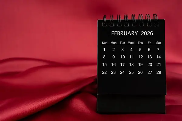 Black Desk Calendar February 2026 Red Satin Silk Textile Background — Stock Photo, Image