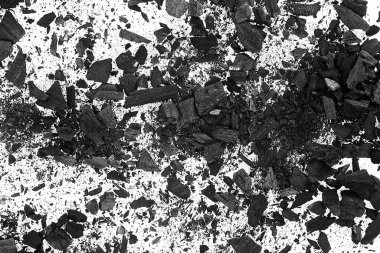 Arkaplan olarak kömür parçacıkları yığını, üst görünüm. Xylanthrax. Ahşap kömür.