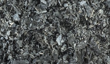 Arka plan olarak yanmış kağıt dokusu. Kağıt küller arka planda. Kül, üst görünüm.