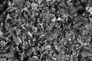 Arka plan olarak ateş tarafından tüketilen kağıt külleri. Yanmış kağıt dokusu. Kül, üst görünüm.