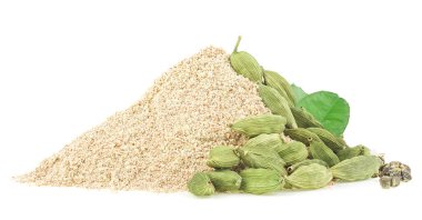 Pile of ground cardamom, cardamom pods and green leaves isolated on a white background. clipart