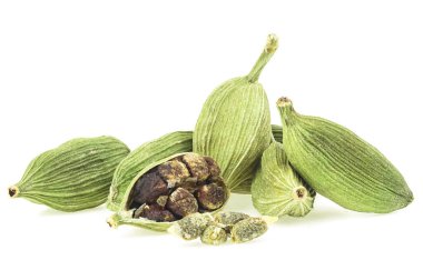 Green cardamom pods and seeds isolated on a white background. Dried cardamom spice.