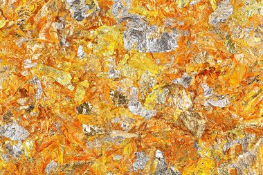 Altın folyodan bir arka plan. Altın folyo dokusu. Folyo yaprakları. Folyo sayfaları.