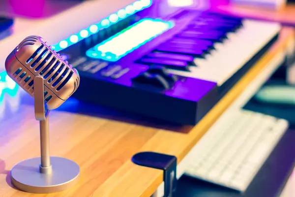 microphone on music keyboard background. singing, recording, broadcasting concept