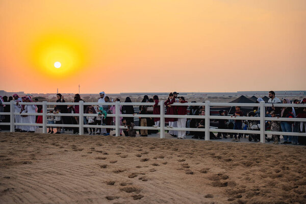 DOHA, QATAR - December 13, 2024: Men riding horses to celebrate Qatar National Day.