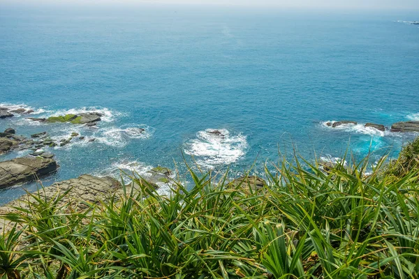 stock image Bitou Cape (Bitoujiao) rocky sea shore beach with blue ocean in a summer day, Ruifang district of New Taipei City, Taiwan