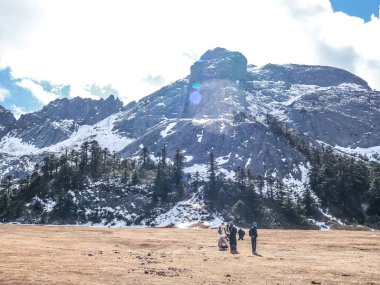 Tourists at Shambhala Stupa Summit Peak located in Balagezong Grand Canyon National Scenic Area of Diqing in Shangri-La County of Yunnan, China clipart