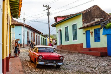 Red classic car in the streets of Trinidad, Cuba, Caribbean