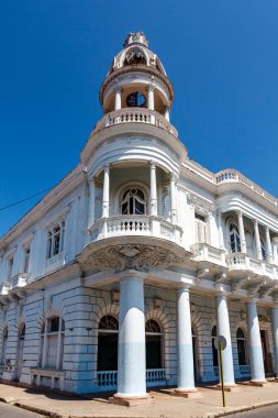 Facade of an old colonial building with tower in the historic center of Cienfuegos, Cuba, Caribbean