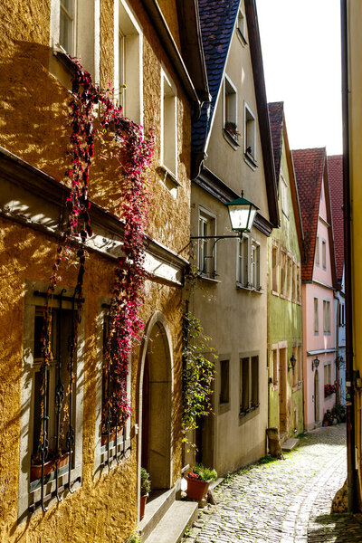 Narrow street with old houses in Rothenburg ob der Tauber, Germany, Europe