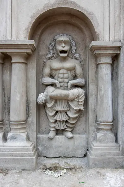 stock image Facade of the Bawali Krishna temple with demon statue, Bawali, West Bengal, India, Asia