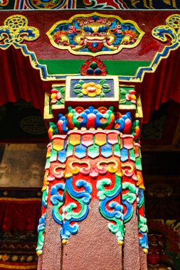 Colorful carved and painted wooden pillar of the Bodhnath stupa in Kathmandu, Nepal Asia clipart