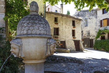 Old fountain on a square in the old town of Vaison-la-Romaine, Provence, France, Europe clipart