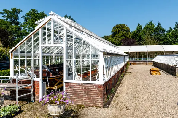 stock image Old white glasshouse in the gardens of Twickel in Delden, Overijssel, The Netherlands