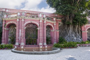 Od portuguese colonial architecture building - pink arcade - in the Saint Francisco Garden in Macau City, China, Asia  