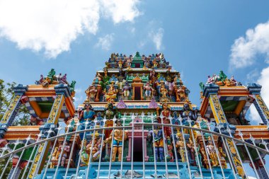 Facade of the Kali Amman Temple in Negombo, Sri lanka, Asia. Detailed view on the vibrant colorful statues of hindu gods on a hindu temple Negombo, near Colombo in Sri Lanka. clipart