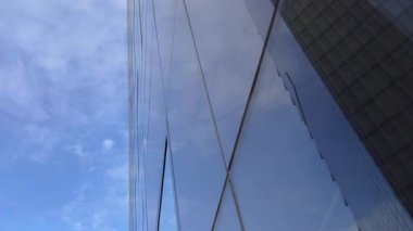 Modern office high rise skyscraper buildings. City business district. Looking up at business buildings. Low angle view of business buildings. Paris France. High quality 4k footage