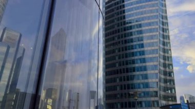 Modern office high rise skyscraper buildings. City business district. Looking up at business buildings. Low angle view of business buildings. Paris France. High quality 4k footage
