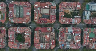 Aerial view of typical buildings of Barcelona cityscape. Eixample residential famous urban grid. Catalonia, Spain. High quality 4k footage