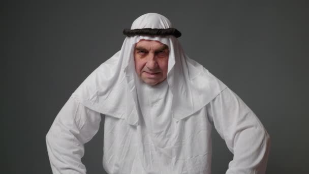 Adult Muslim Man White Traditional Clothes Looks Camera Expresses Emotions — Vídeo de stock
