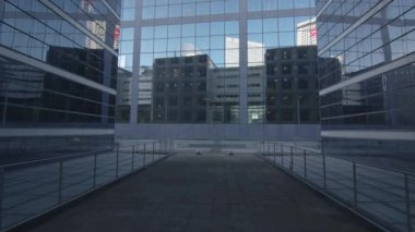Business district building with wall mirror with blue sky, Paris, France. High quality 4k footage