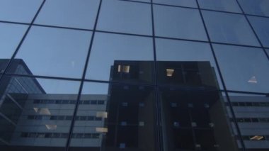 Business district building with wall mirror with blue sky, Paris, France. High quality 4k footage