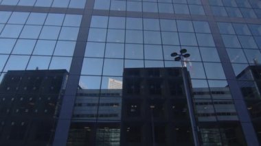 Modern office high rise skyscraper buildings. City business district. Looking up at business buildings. Low angle view of business buildings. Paris France. High quality 4k footage