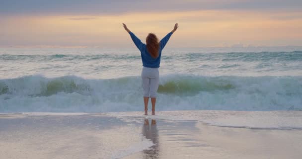 Woman Ocean Beach Raises His Arms Sky — Stock Video