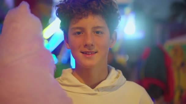 Close Portrait Teenager Holding Large Cotton Candy Front Amusement Park — Stock Video