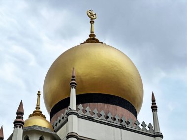 The Sultan Mosque in Singapore is topped with large dome covered in gold leaf