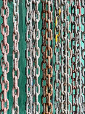 Rusty chains at an old boat yard on San Juan Island create a background image with an industrial pattern. clipart