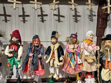 A line-up of traditional Czech puppets showcases an example of this common folk art in Czechia. clipart